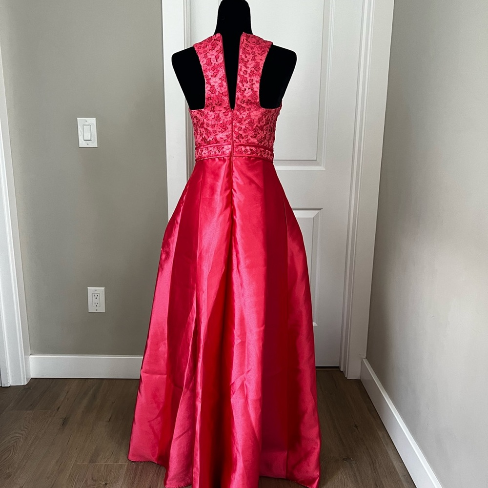Monique Lhuillier coral formal dress.